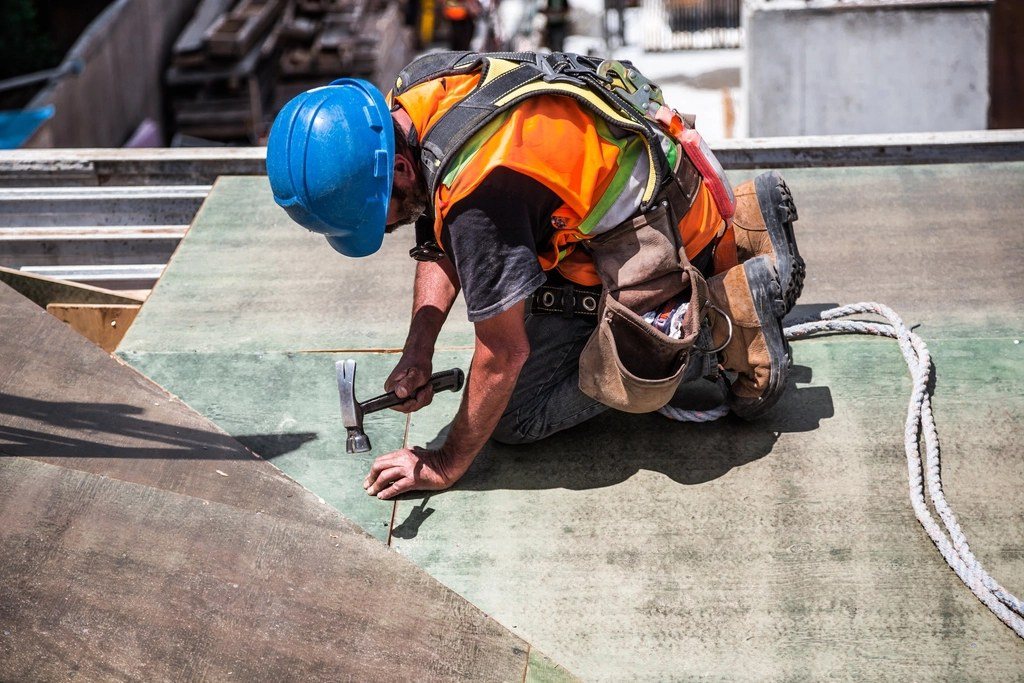 Roofer at work on a roof